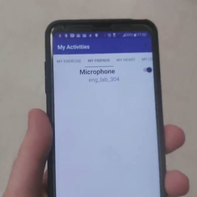 A handheld phone displays the word 'Microphone' with the words 'engineering lab 304' underneath.